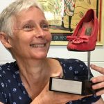 Christina lee with one of her Scarlet Stiletto trophies