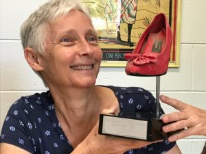 Christina lee with one of her Scarlet Stiletto trophies